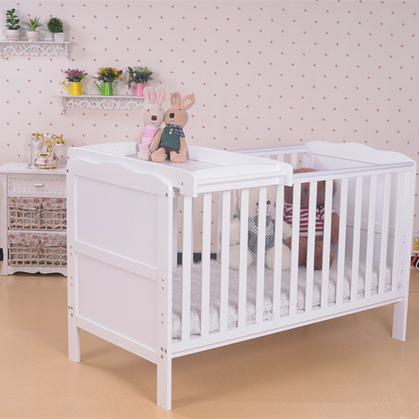 white wooden cot bed